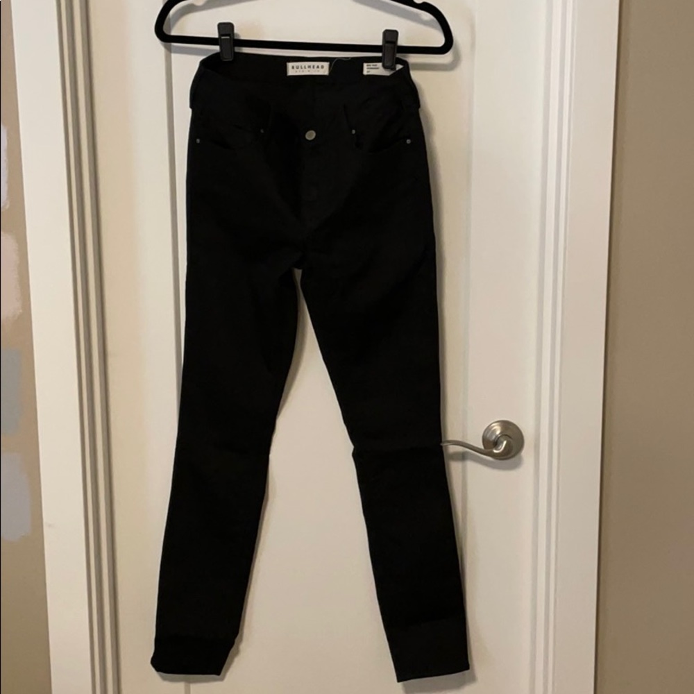 Mid rise black skinny jeans